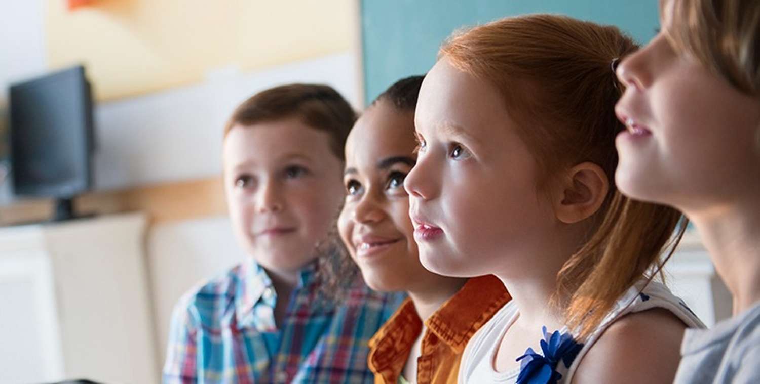 Several-kids-looking-up-at-teacher_Clay-County