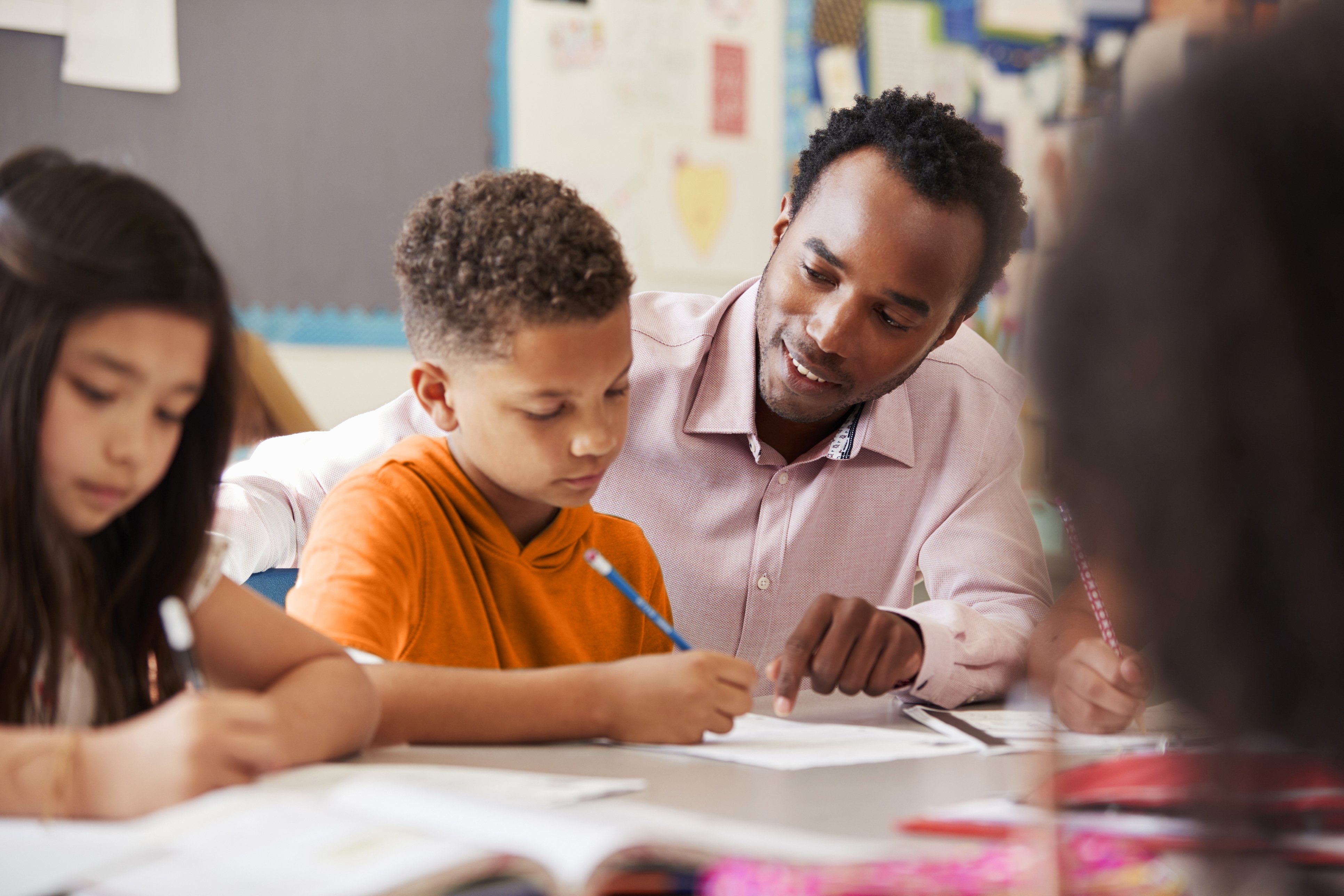 male teacher with boy student